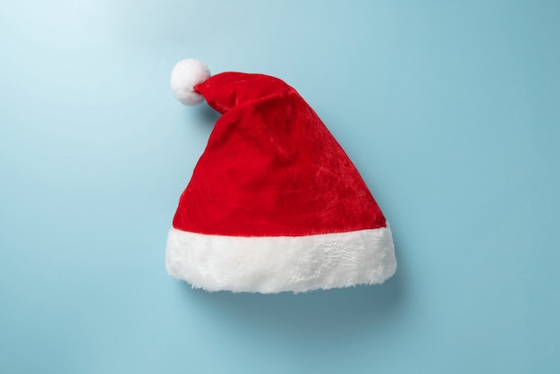 Top view of Santa claus hat on blue.