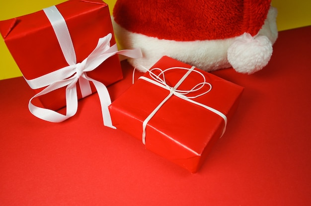 Top view of santa hat and red gift boxes. Christmas background. High quality photo