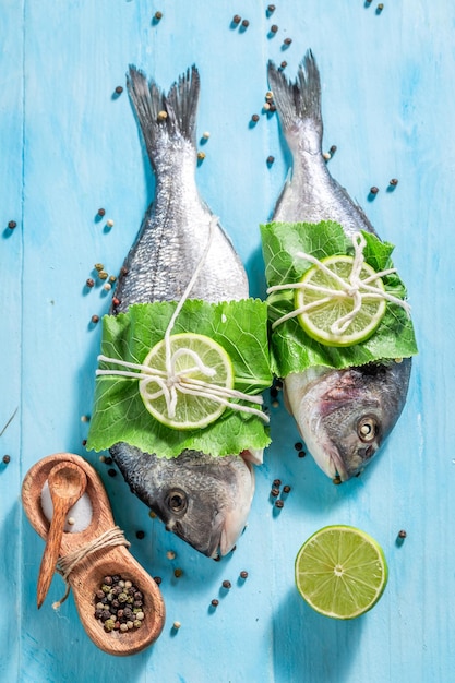 Top view of sea bream with pepper salt and horseradish