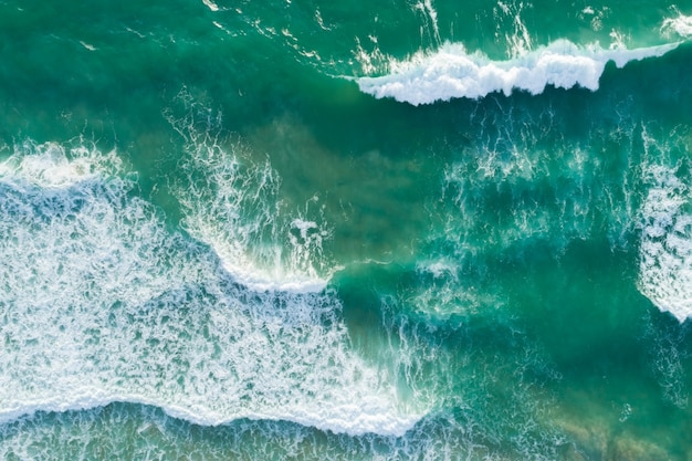 Top View of the Sea texture waves Foaming and Splashing in the Ocean Sunny day beautiful sea surface background.