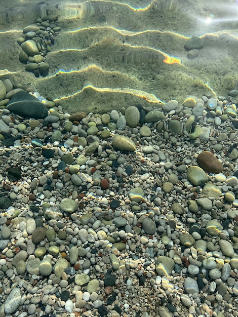 Photo top view of seabed with pebbles