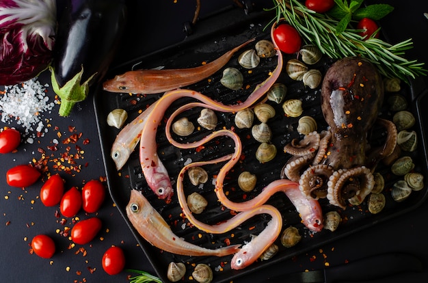 Top view of seafood with vegetables for cooking