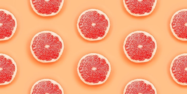 Top view seamless background of sliced fresh grapefruit