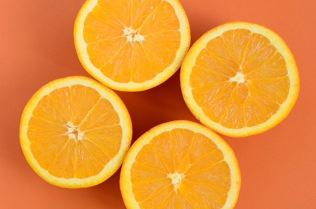 Top view of a several orange fruit slices