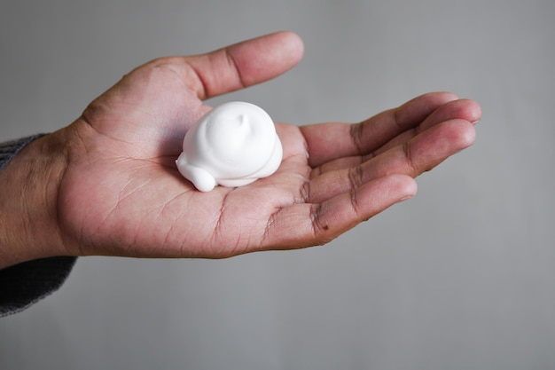 Top view of shaving foam on hand