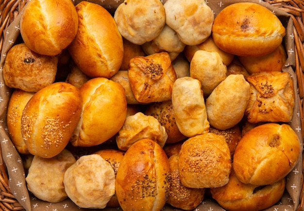 Top view shot of different type of breads in a basket