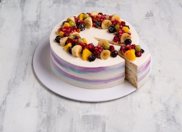 Top view shot of a fruit cake on a white plate