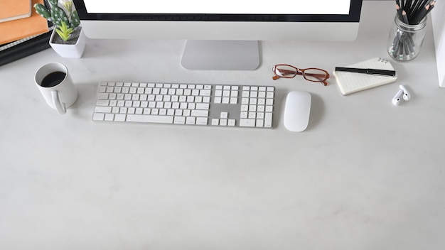 Top view shot of office desk with marble table. Office equipment on working desk. Modern office concept.