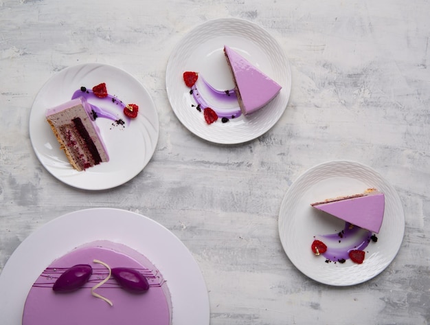 Top view shot of purple cake sliced on a white plates.