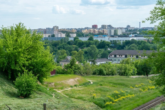 Top view of the sleeping area of a big city Autumn city landscape Green spaces next to highrise modern buildings