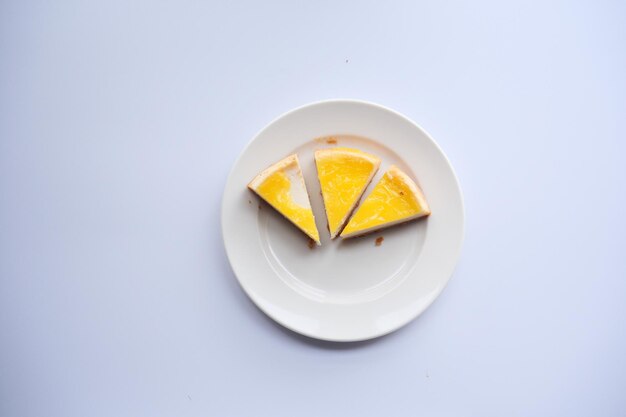 Top view of slice of cheese cake on a plate