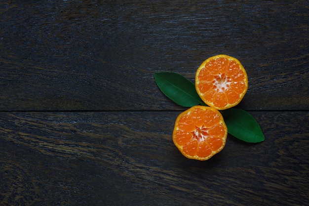 Top view sliced orange on rustic wooden with copy space.