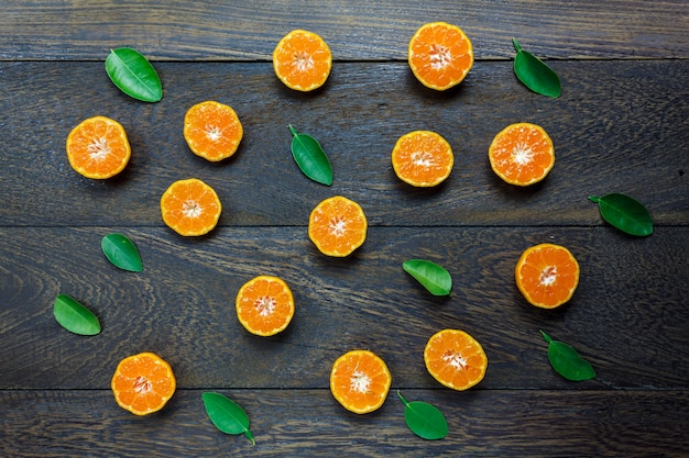 Top view sliced orange on rustic wooden.