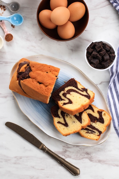 Top View Slices of Homemade Marble cake on a White Oval Plate for Accompanied Tea Time