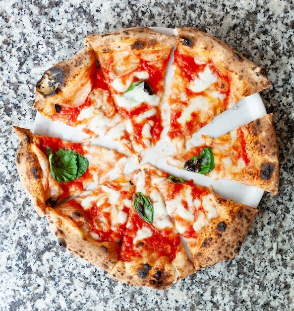 Top view of slices of pizza margherita.