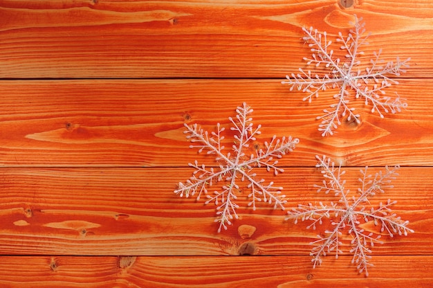 top view snowflakes on wooden planks