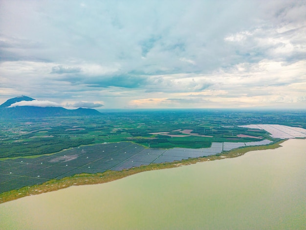 Top view of Solar panels on farm Dau Tieng Lake Alternative source of electricity solar panels absorb sunlight as a source of energy to generate electricity creating sustainable energy Eco concept