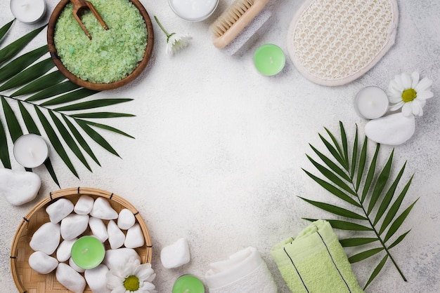 Top view spa towels with stones on the table