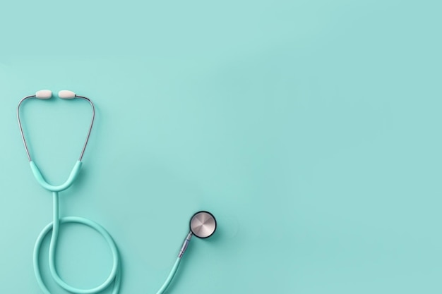 Top view of stethoscope on color background with empty copy space flat design Health medical concept