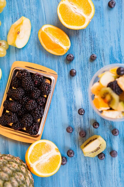 Top view of summer delicious desert. Bowl full of delicious fruits