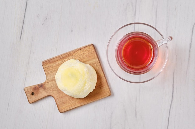 Top view of sweet dessert mochi with banana and chocolate with fruit tea