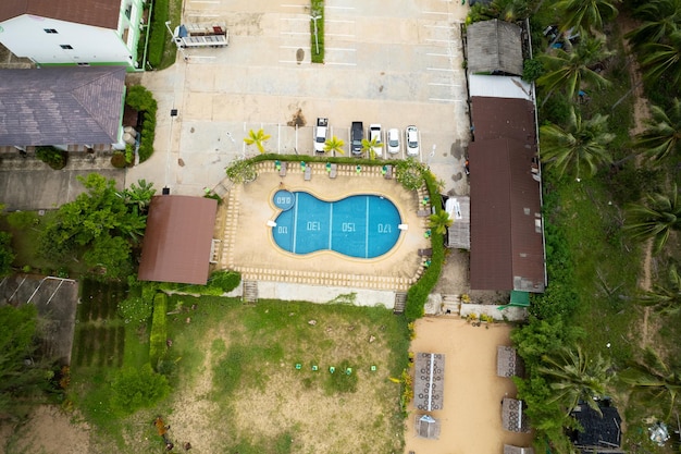 Top view swimming pool with blue water aerial view resort and parking lot outdoor