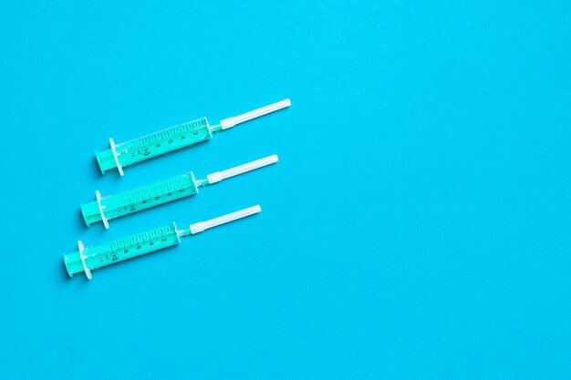 Top view of syringes in a row for medical injection