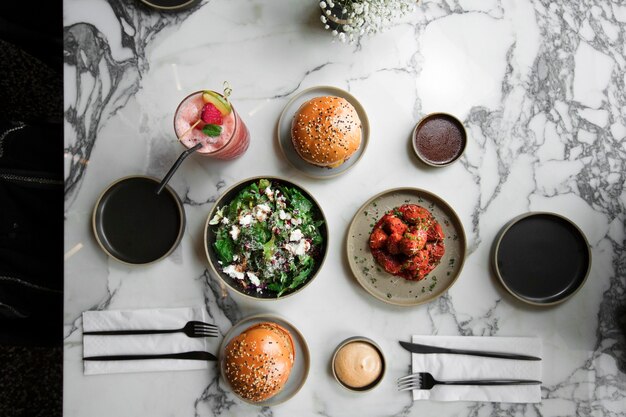 Top view for a table of various foods burger and shrimps