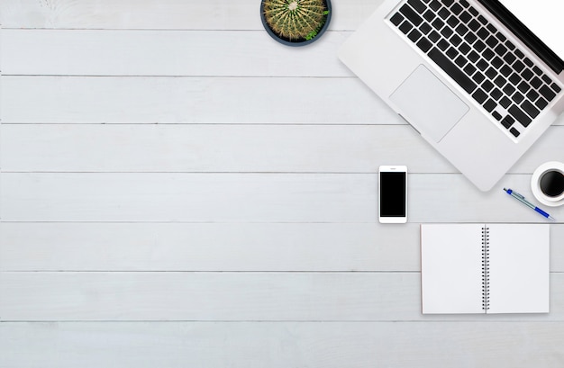 top view tablet smartphone  computer notebook on background wood