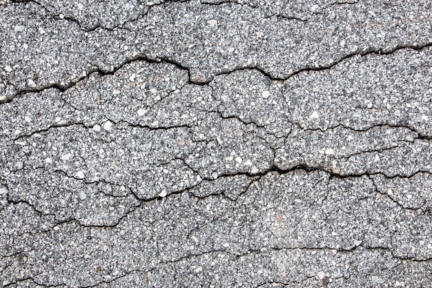 Top view of tarmac pavement showing interesting crack feature