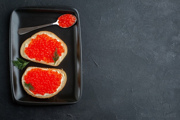 top view tasty caviar sandwiches inside plate.