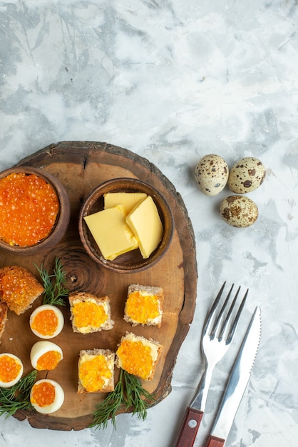 top view tasty caviar sandwiches with boiled eggs on wooden board white background breakfast meal seafood fish lunch toast