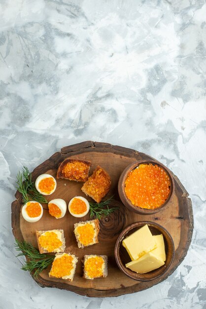 top view tasty caviar sandwiches with boiled eggs on wooden board white background breakfast toast food meal seafood fish