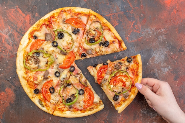 Top view tasty cheese pizza sliced and served on dark brown surface