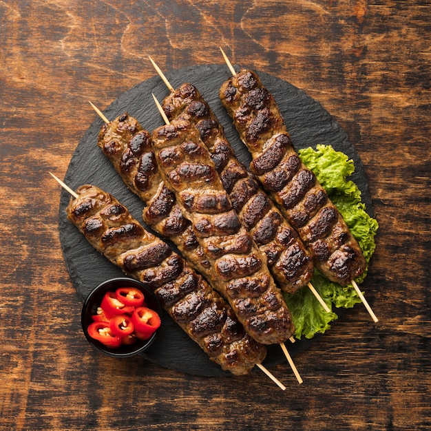 Top view of tasty kebab with meat and salad