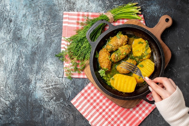 Top view tasty meat rissole with boiled potatoes and greens on gray background female color salad cooking food kitchen meal dinner