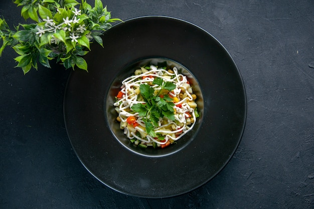 top view tasty potato salad decorated with green leaf and mayyonaise inside plate dark surface food lunch meal horizontal colour