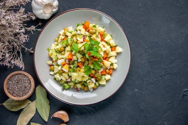 top view tasty vegetable salad with seasonings on dark surface diet food lunch meal horizontal health colour cuisine bread