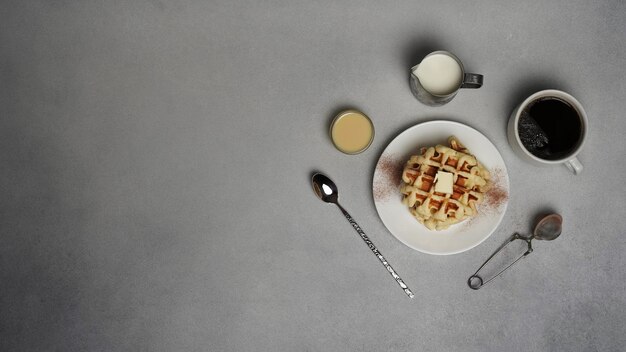 Top view of tasty Waffles Plate on a Grey concrete Background