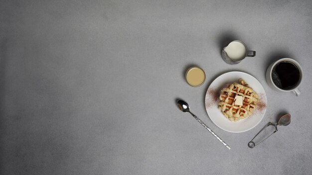 Top view of tasty Waffles Plate on a Grey concrete Background