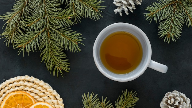 Top view tea with lemon and pine needles