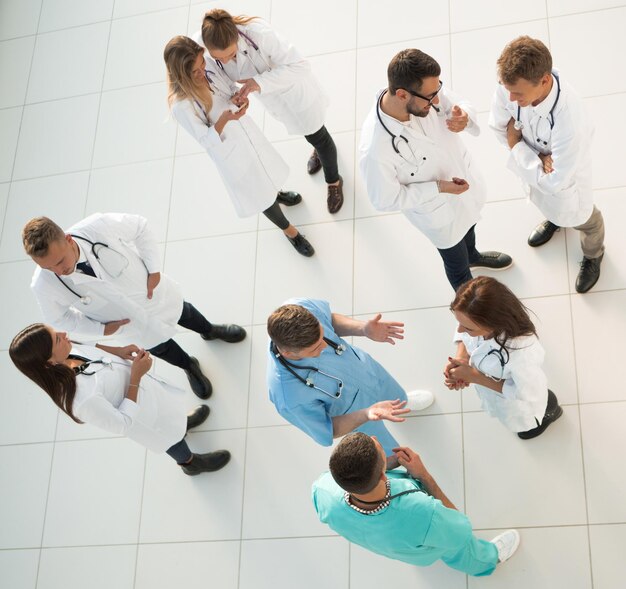 Top view team of medical professionals discussing issues\
together