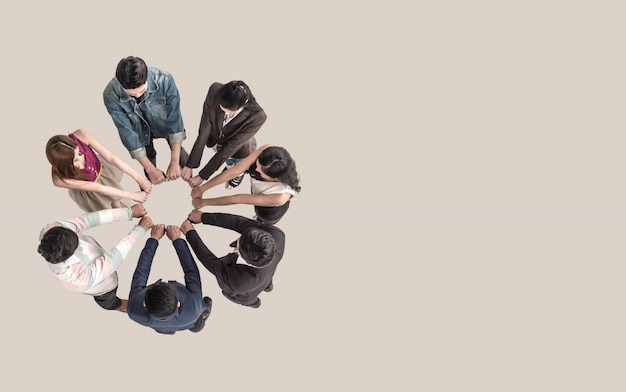 Photo top view of teen people in team fist bump assemble together.