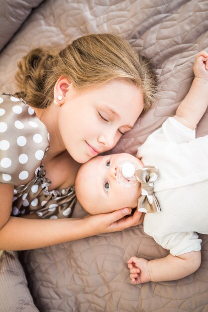 Top view of a teenage girl and brother