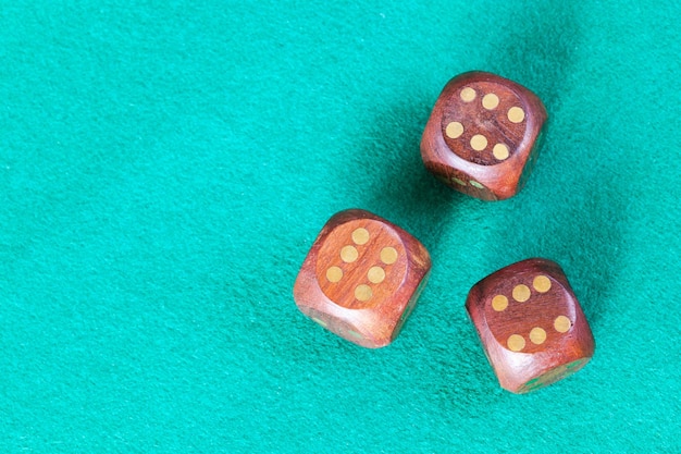 Top view of three wooden dices with six points