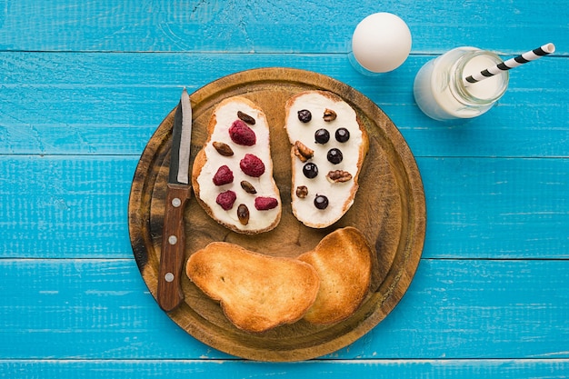 Top view of toast bread butter and berries. Copy space