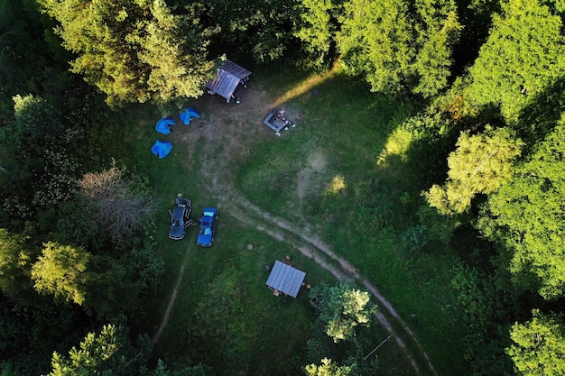 Top view of the tourist base and Bolta lake in the forest in the Braslav lakes National Park at dawn