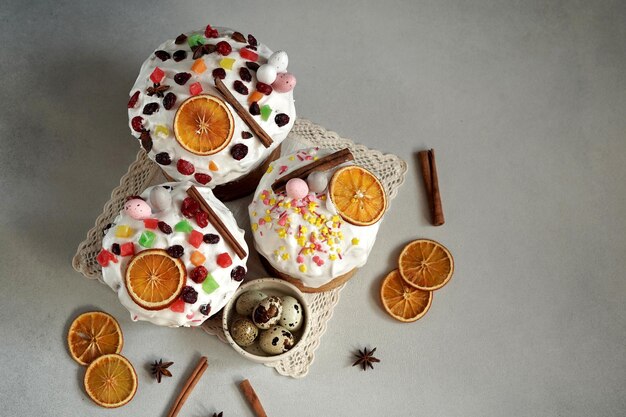 Top view of Traditional Easter Cakes decoreted with dried Fruits on Grey Background Easter eggs