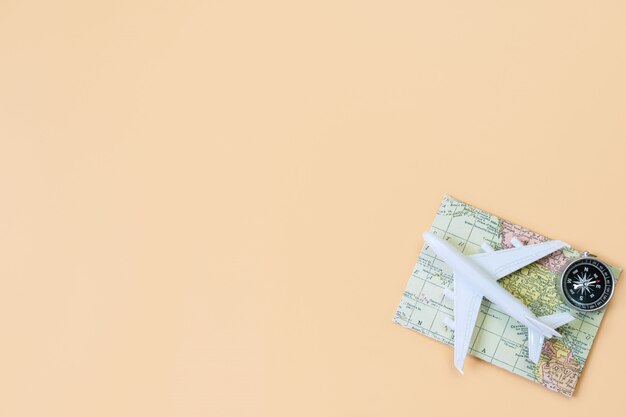 Top view of travel accessories on orange background