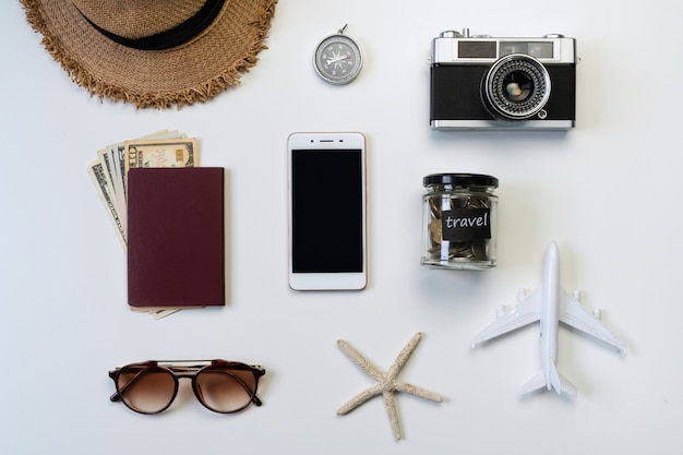 Top view of travel accessories  on white